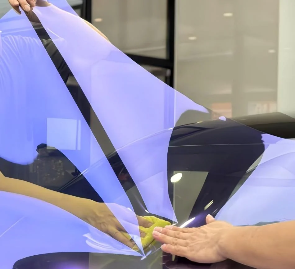 Window film being fitted to automotive glass in the supplied catalog