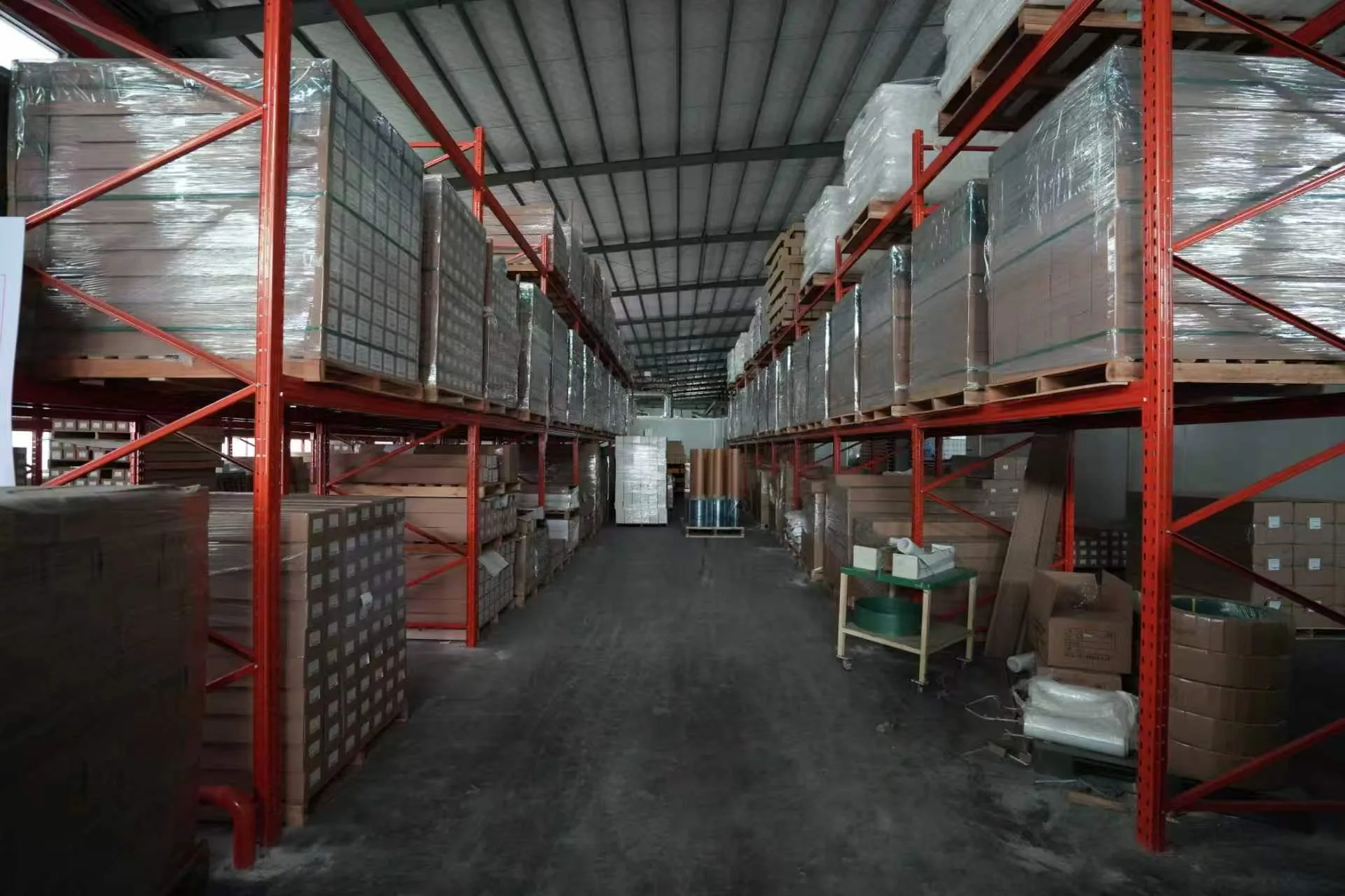 Finished goods warehouse with film rolls stored on racks